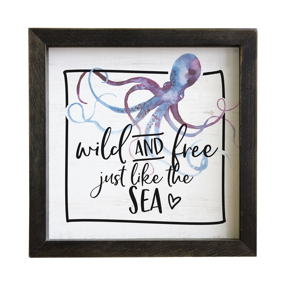 The "B - Wild & Free" by SincereSurroundings is a handcrafted framed print with a watercolor octopus and the handwritten-style quote "wild and free just like the sea," plus a heart, in a warm dark wood frame—ideal for primitive home decor.