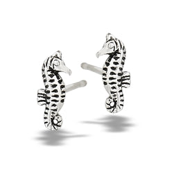 Welman’s Sea Horse Silver Stud earrings feature sterling silver seahorse shapes with black striped detailing. Shown on a plain white background, these mask-friendly studs are designed for comfortable everyday wear.