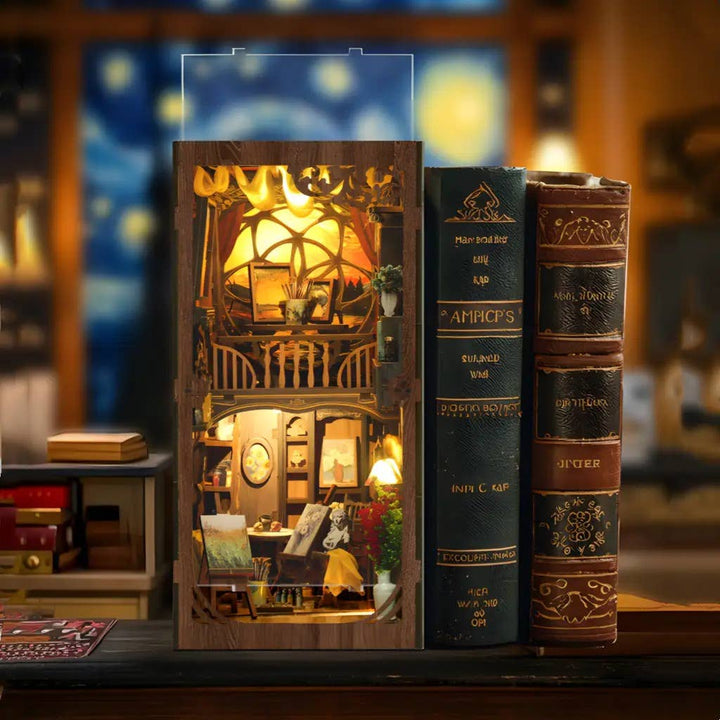 The Hands Craft DIY Book Nook Kit: Golden Twilight Studio creates a warmly lit miniature library, with touch-activated LED lights, nestled between vintage hardcovers on a wooden table in a cozy study.