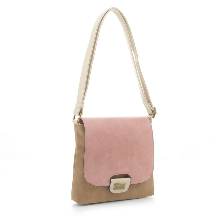 The Amy Crossbody - Coral by Liz Soto Handbags is a vegan leather shoulder bag featuring a light brown body, pale pink flap, beige adjustable strap, and rectangular metal clasp—ideal for modern crossbody style.