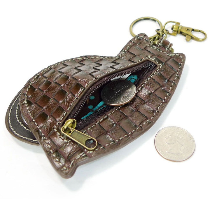 A small Chala Cat Keychain with Zip, made of brown woven leather and featuring antique brass hardware and a zipper, is open to display a few coins inside. It also includes a keychain attachment. Next to the pouch, a quarter rests on the white background.