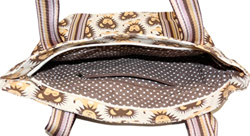 The Striped Tote - Lion by Bungalow 360 is a spacious cotton canvas bag with a lion design, brown and white polka dot lining, small inner pocket, and two striped handles.