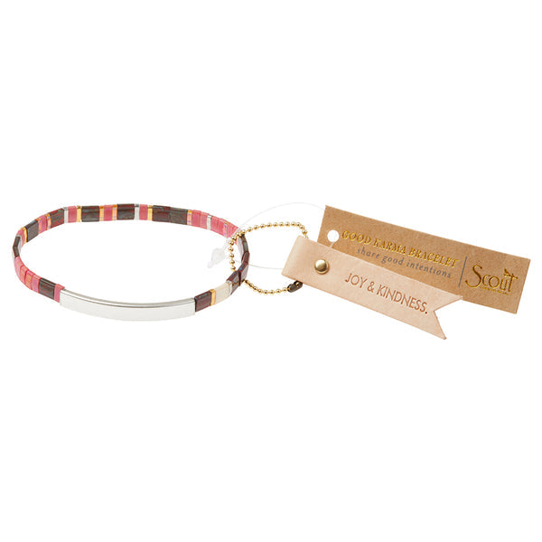 The Miyuki Joy and Kindness Mulberry Silver bracelet by Scout Jewelry features colorful stripes and a Sterling silver dipped bar, attached to a "GOOD KARMA BRACELET" tag with "JOY & KINDNESS," all on a small gold ball chain.