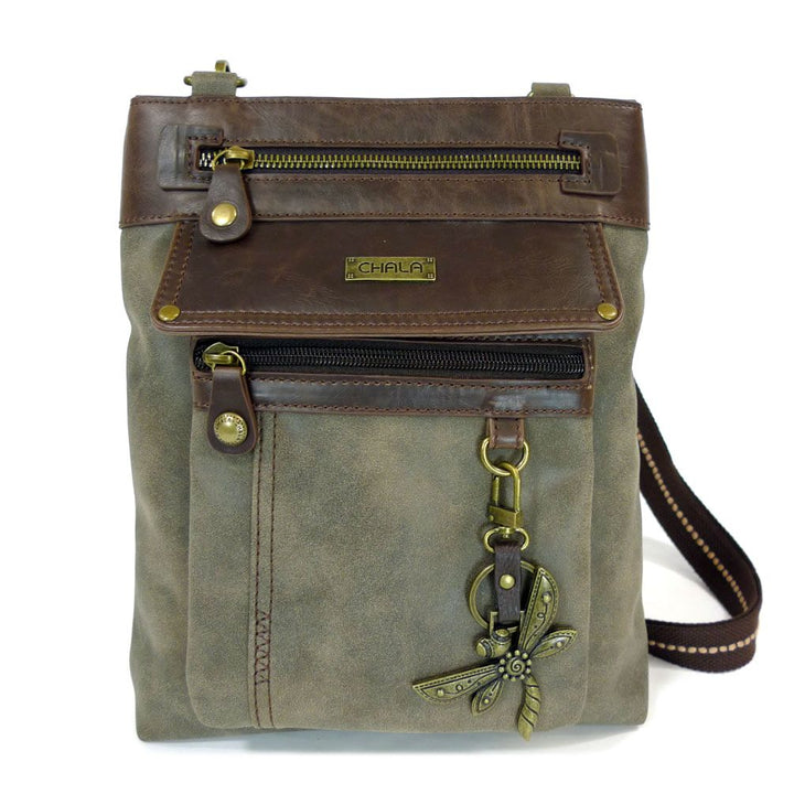 Introducing the Gemini Xbody w DF Stone by Chala—a chic crossbody bag that highlights a brown faux leather flap, adorned with two front zippers and a charming brass dragonfly. This stylish accessory is completed with a strap featuring intricate stitching, the signature "Chala" logo badge at the top, and a detachable front pocket for added versatility.