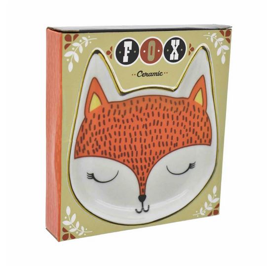 The Fox Trinket Dish by Streamline is a delightful ceramic piece shaped like a fox with an adorable closed-eye design in orange and white, elegantly packaged with "FOX" at the top. The packaging features a light green background embellished with small decorative leaves, making it an enchanting addition to any decor.