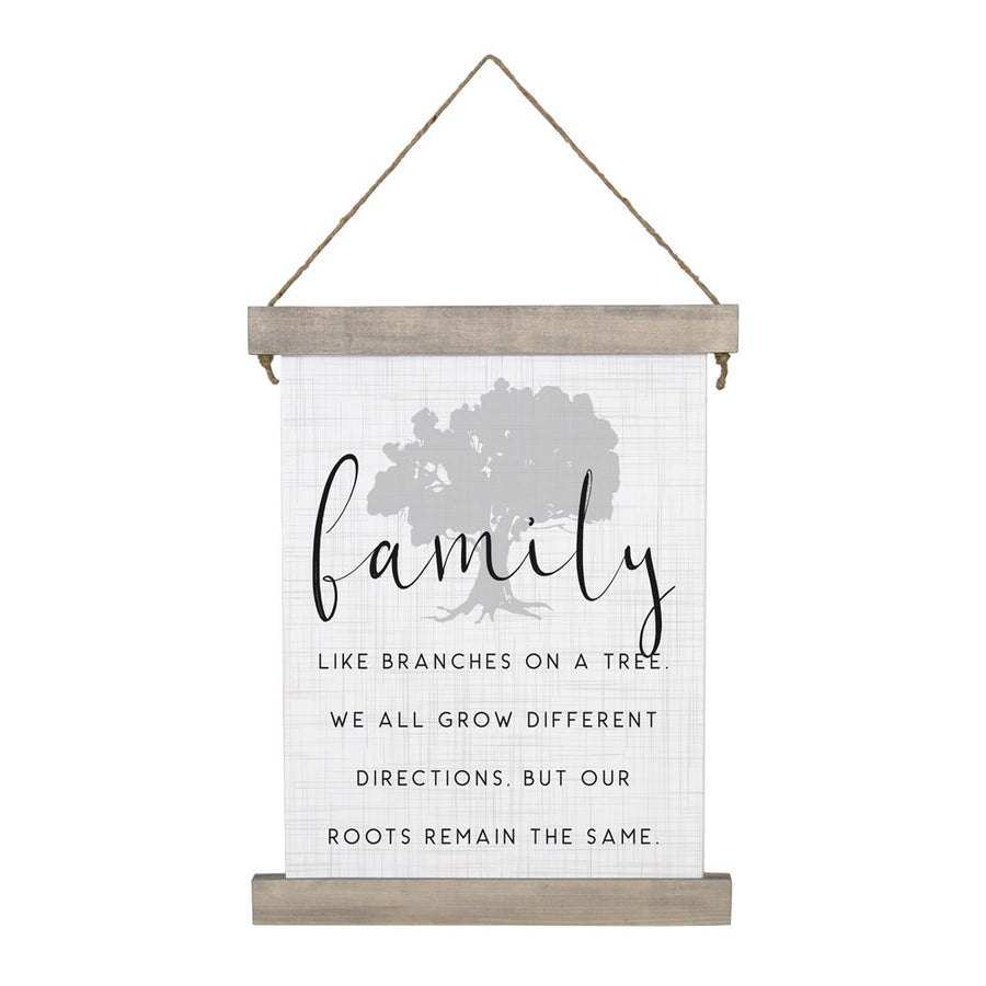 The "Family Like Branches" sign by SincereSurroundings is a stained wood-framed hanging decoration displaying the word "family" in bold cursive. It includes the sentiment: "Like branches on a tree, we all grow different directions. But our roots remain the same." A subtle tree silhouette serves as the background, enhanced with twine detailing.