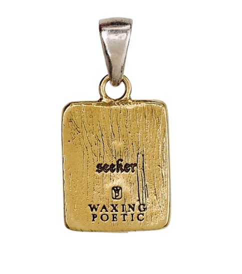 A rectangular gold Momento Charm - Dragonfly pendant by Waxing Poetic, featuring a silver bail and engraved with "seeker" and "WAXING POETIC" on its textured surface.
