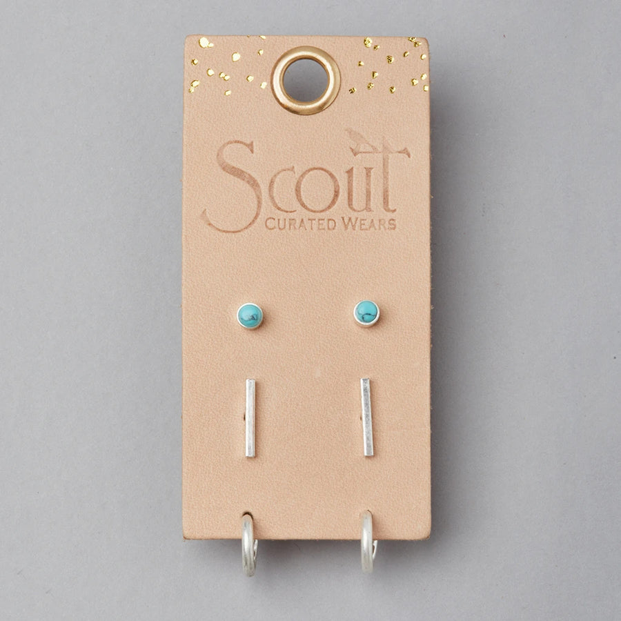 The Scarlett Stud Trio Turquoise Silver by Scout Jewelry includes three hypoallergenic earring pairs—turquoise stone studs, silver bars, and silver hoops—on a beige gold-speckled card labeled "Scout Curated Wears.